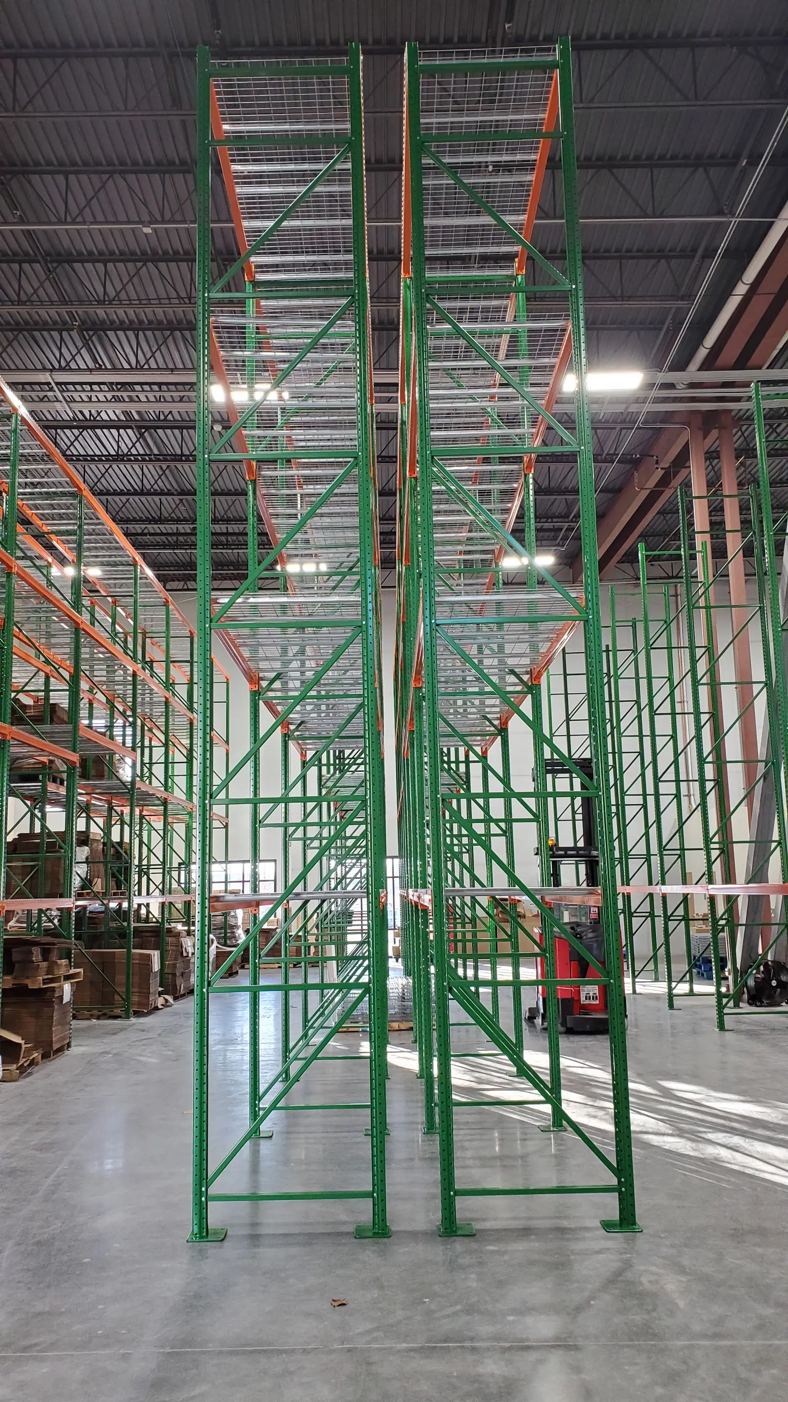 High-bay pallet rack uprights in a distribution center