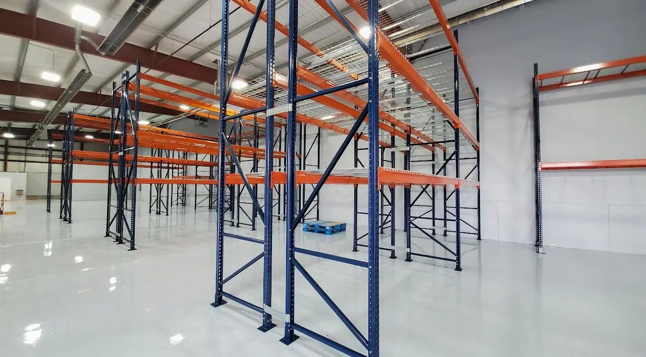 New pallet racks installed in a bright warehouse