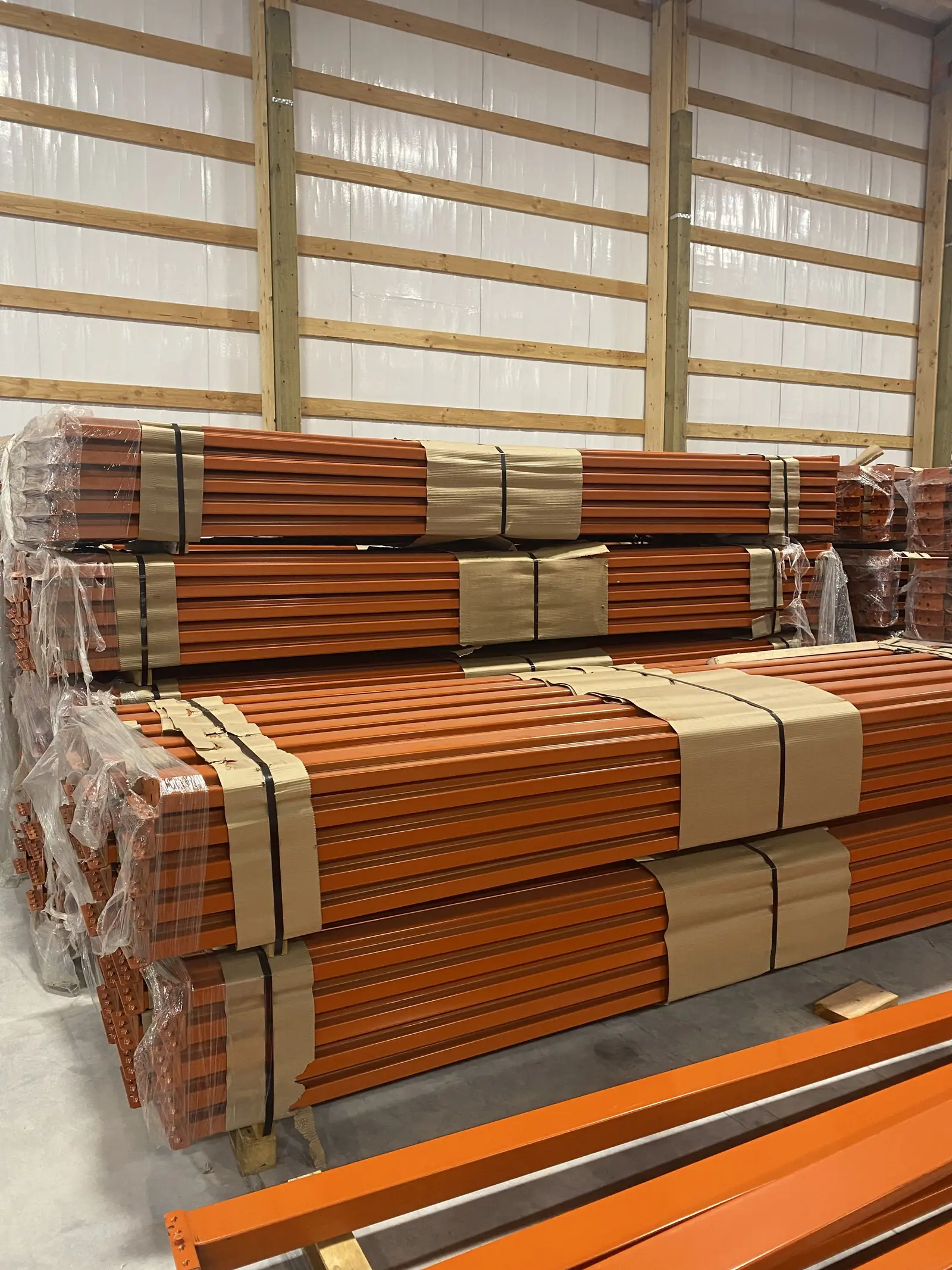 Bundles of new pallet rack beams in stock at the Albany warehouse