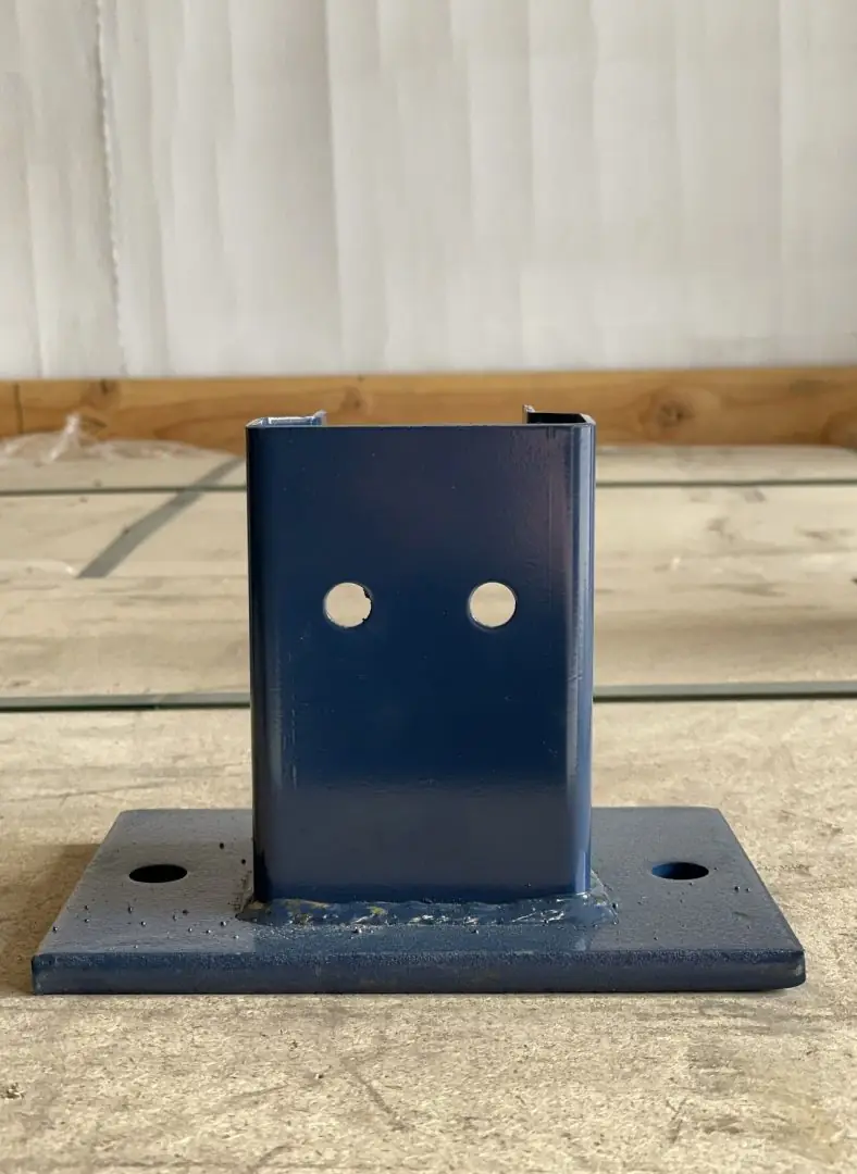 Steel upright guard protecting a pallet rack column