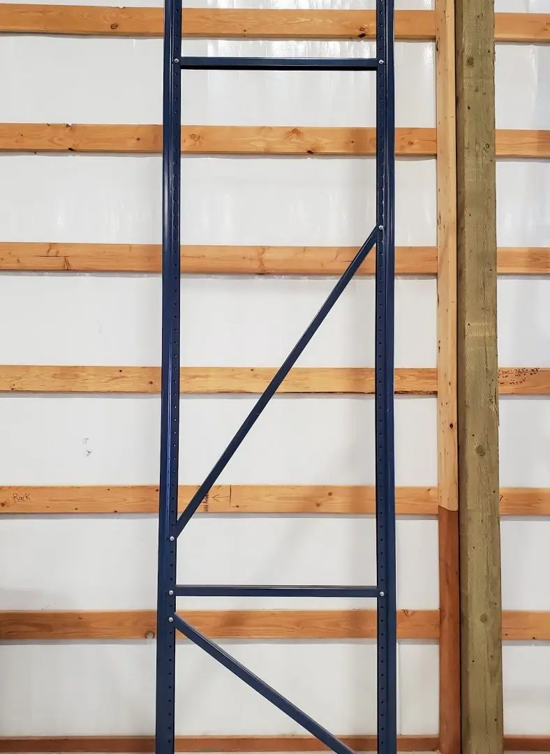 Navy pallet rack upright installed in a pole barn